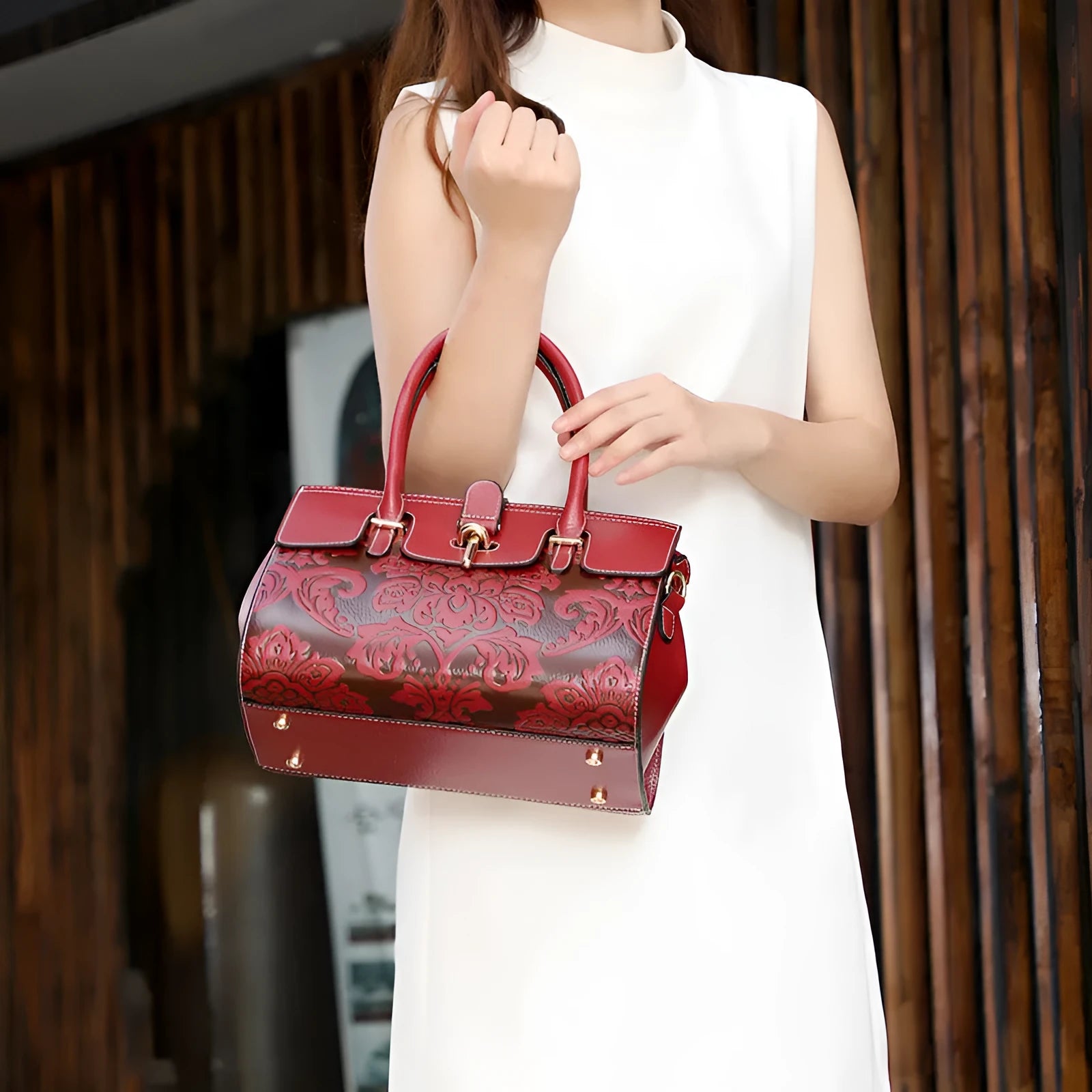 Red vintage women's crossbody leather bag with embossed pattern and multiple internal compartments