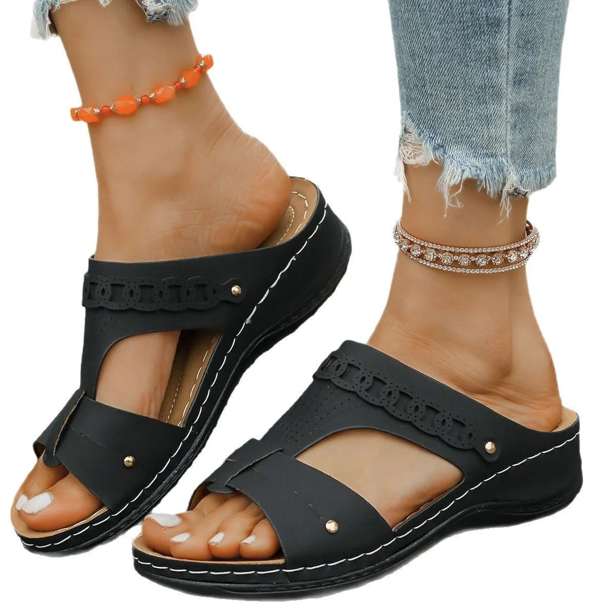 Casual blue Roman style slippers on a white background, showing slope heel and fish mouth toe design.