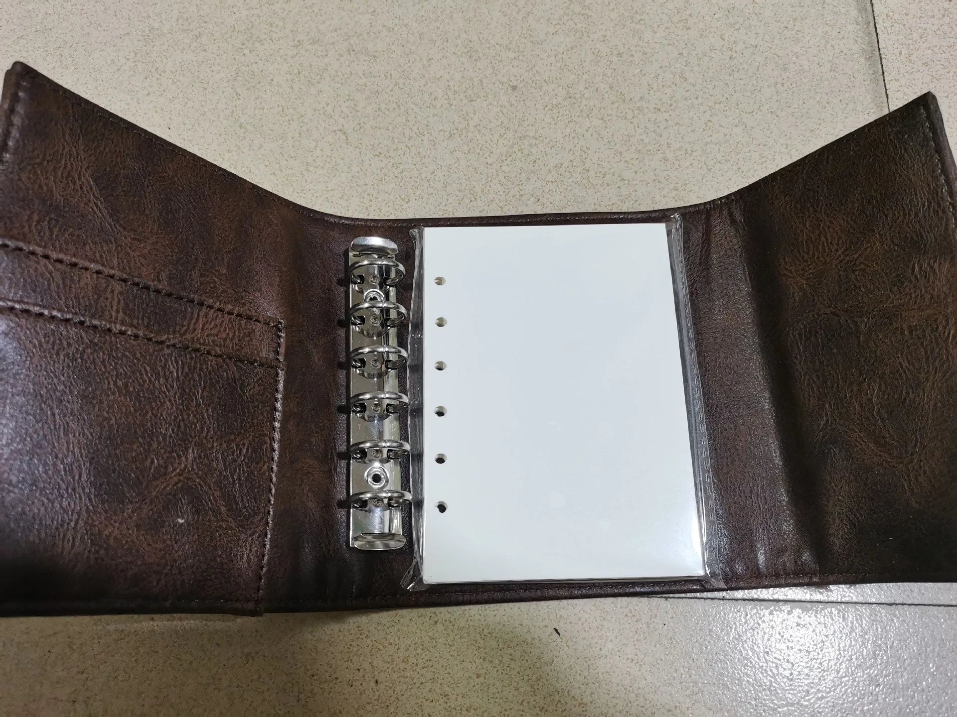 A7 brown PU leather buckle notebook with loose-leaf binding and 40g paper