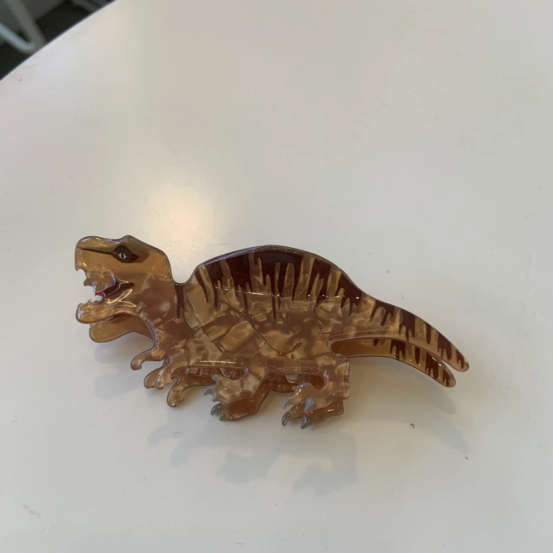 Acrylic dinosaur-themed hair clip with jaw grip design in one of six colour variations