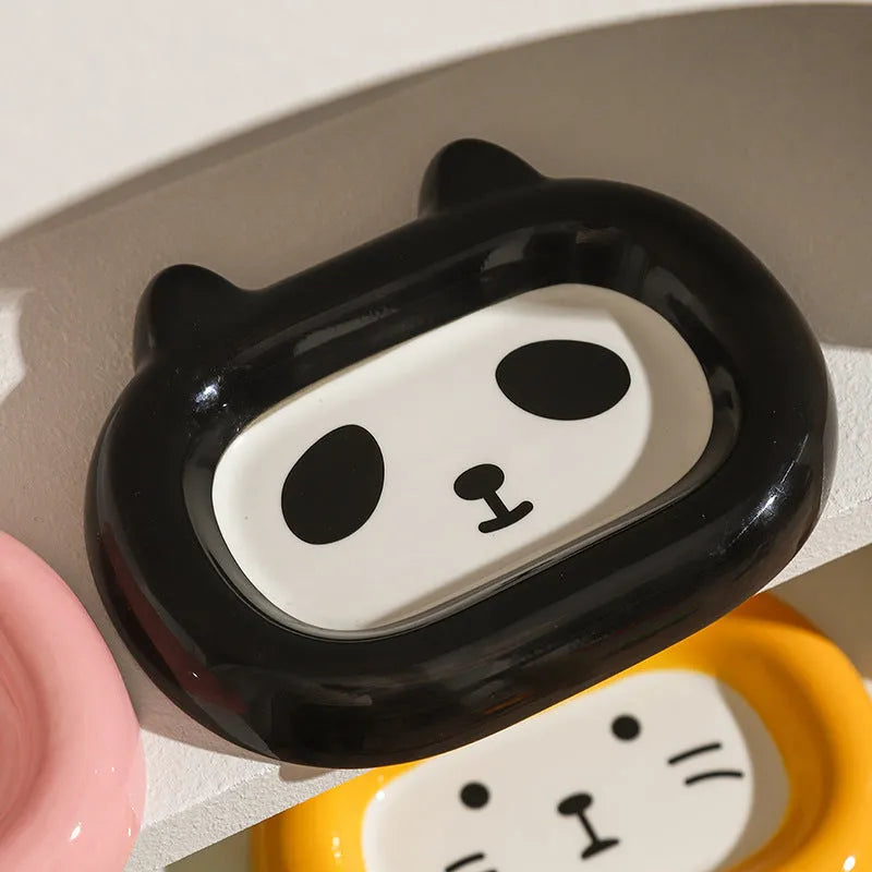 Ceramic pet feeding bowl with a choice of cat, frog, panda, or pig animal motif design.