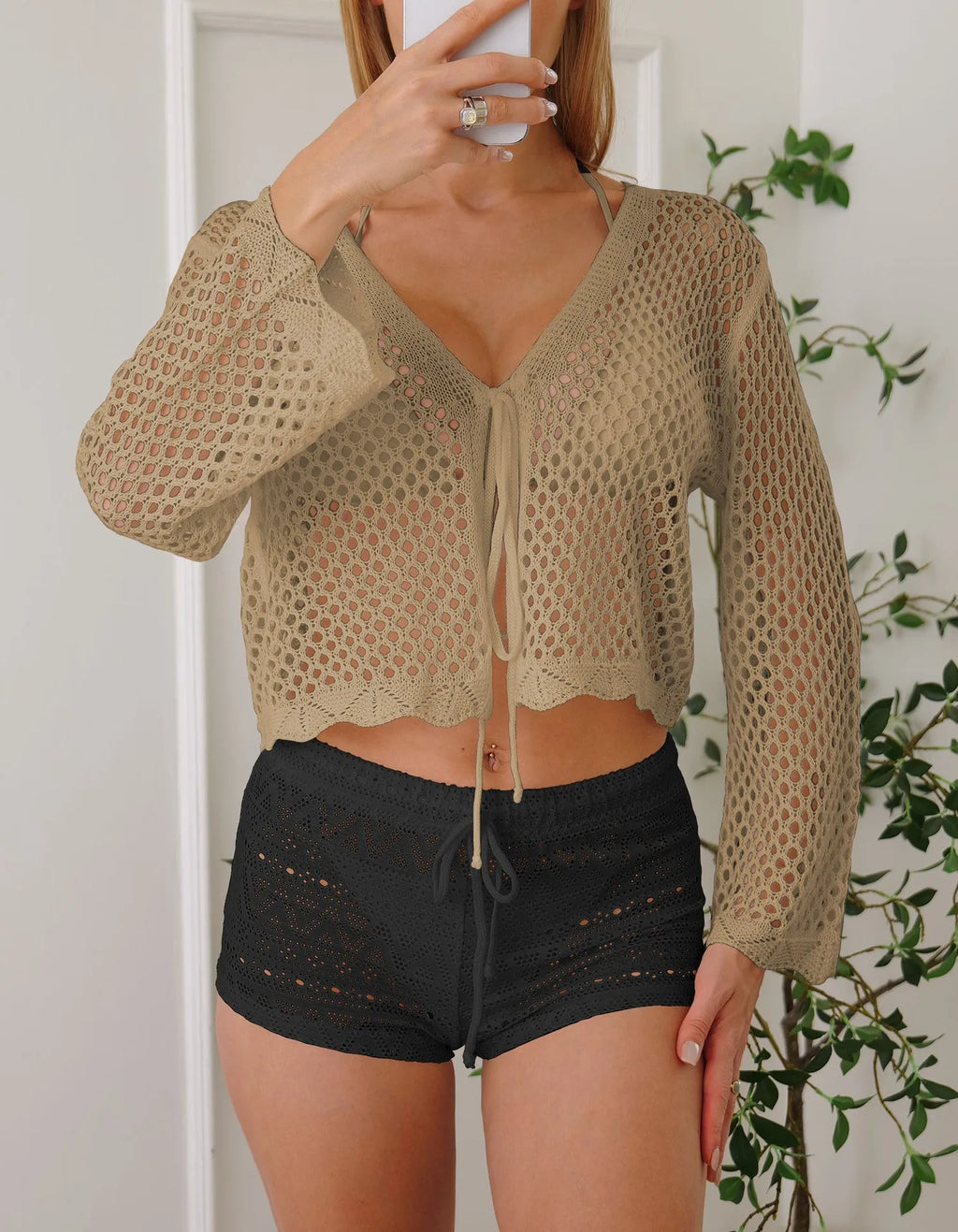 Women's hollow woven cardigan blouse with bell sleeves in apricot colour showing short 40cm length
