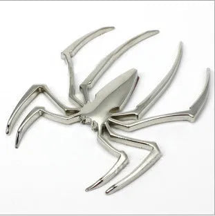 Three-dimensional metal spider bumper sticker in zinc alloy, showing gold, silver, black, and red colour options.