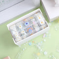 Five rolls of transparent decorative tape with colourful Midsummer Daisy cartoon designs