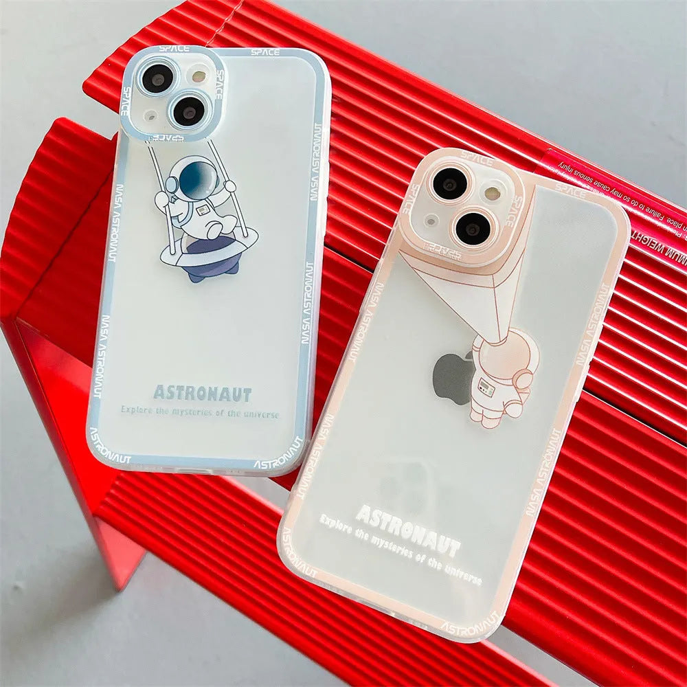 Clear silicone phone case with blue astronaut print, shown fitted on an iPhone.