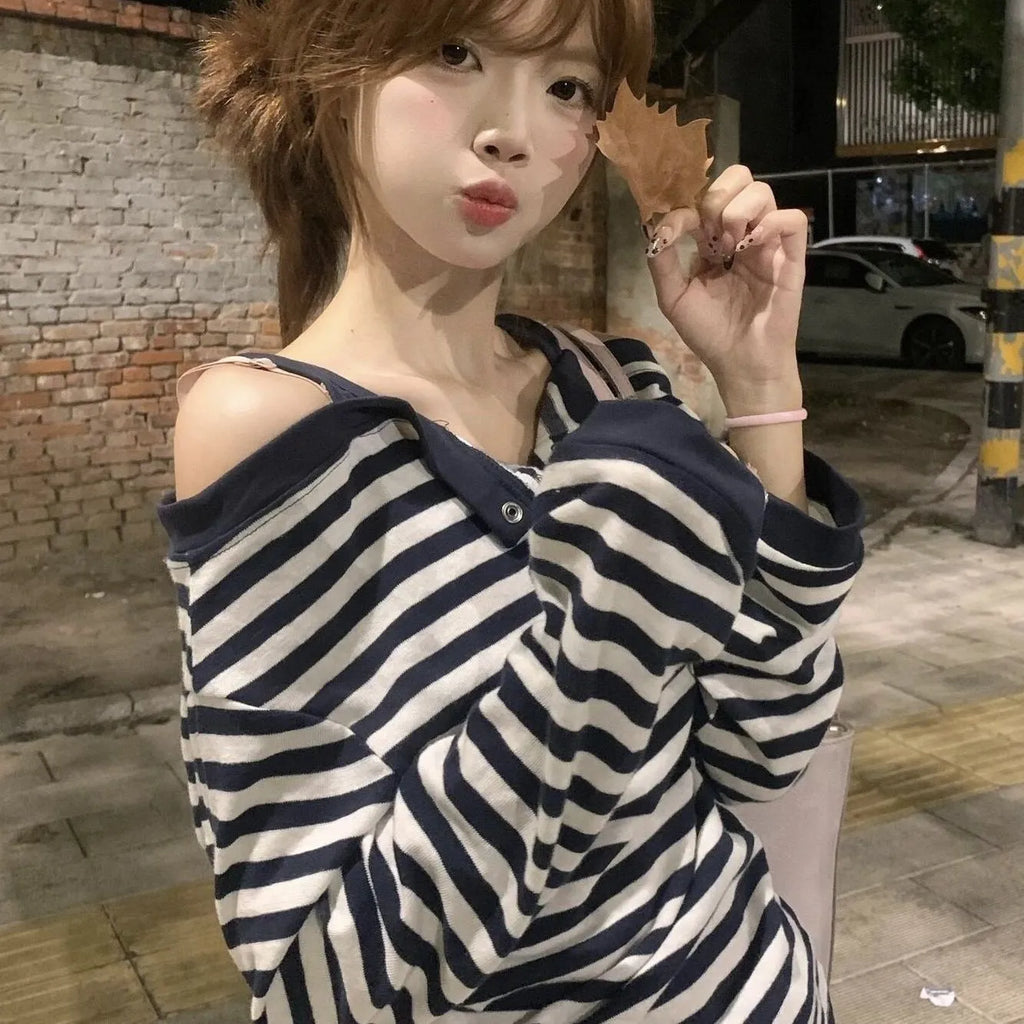 Dark blue oversized women's long-sleeved t-shirt with Korean-style embroidery and button details.