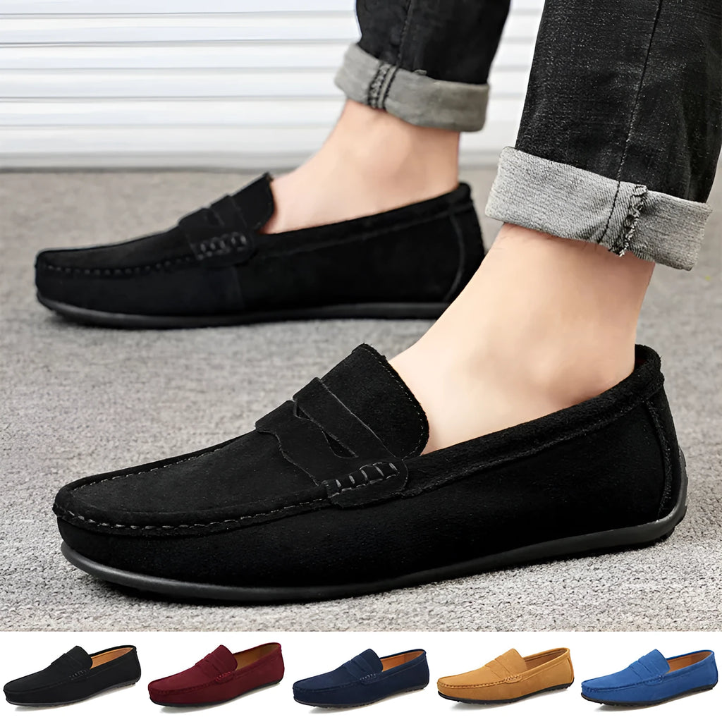 Men's solid colour suede loafers with round toe and flat rubber sole.