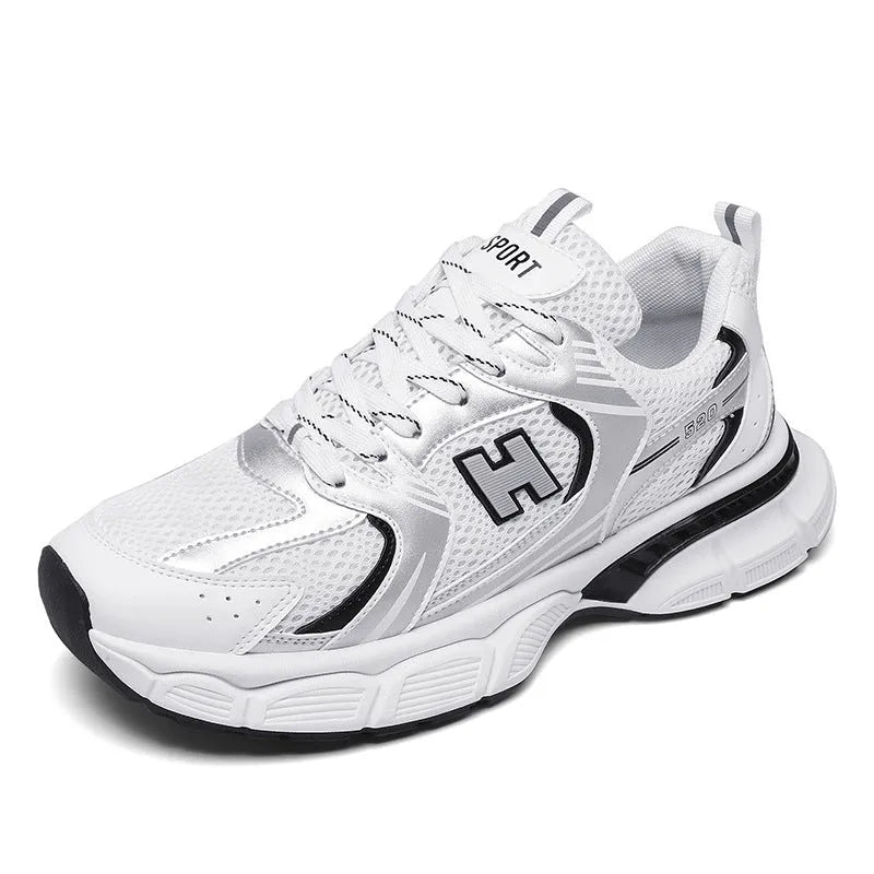 Men's solid colour mesh running shoes with a plastic sole, shown in black, white and grey, and white and orange.