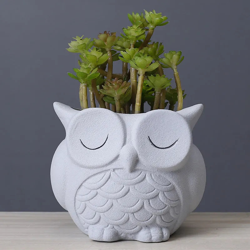 Handmade frosted ceramic owl design succulent flower pot in light pink colour.