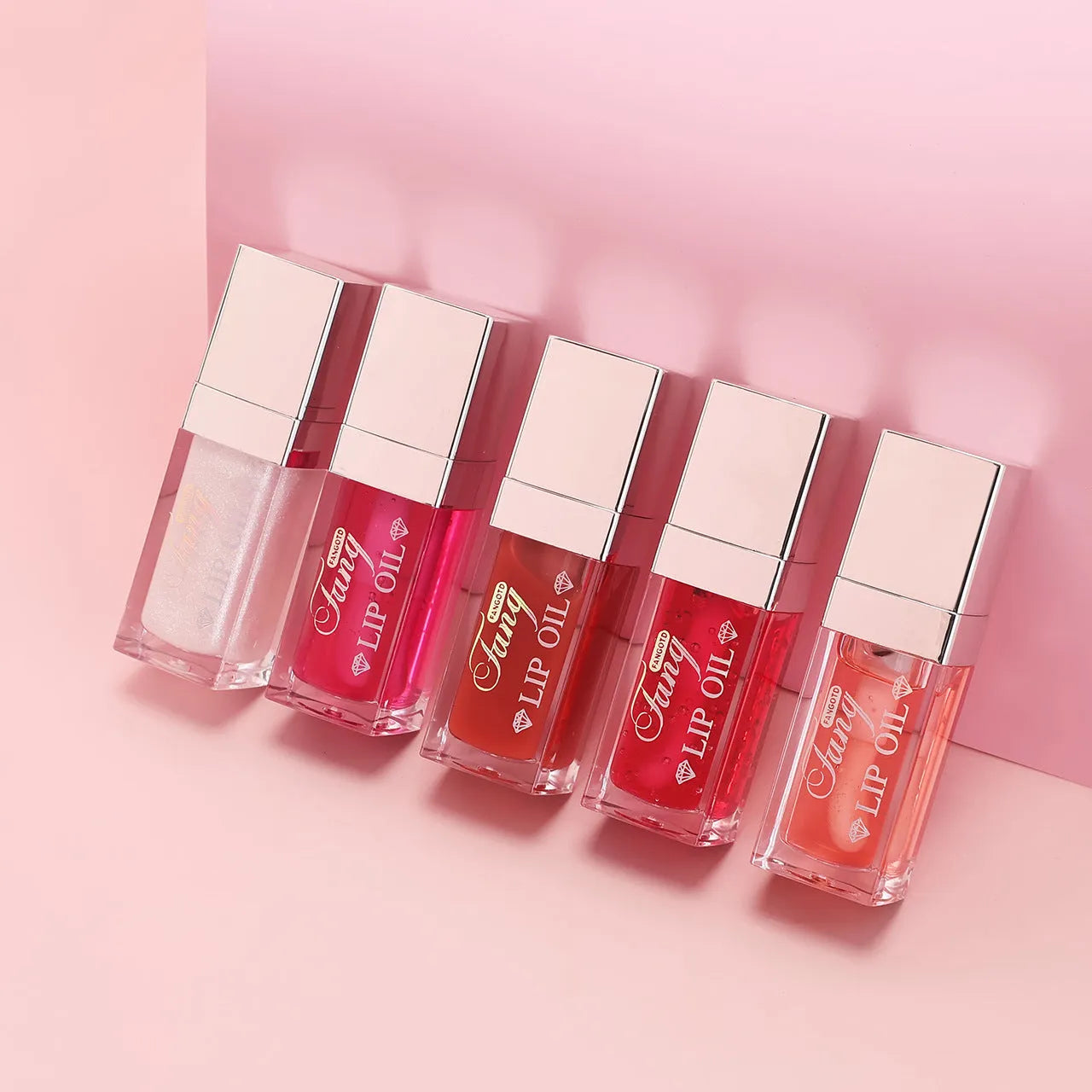 Mint lipstick set with five colour shades and a lip essence oil bottle.