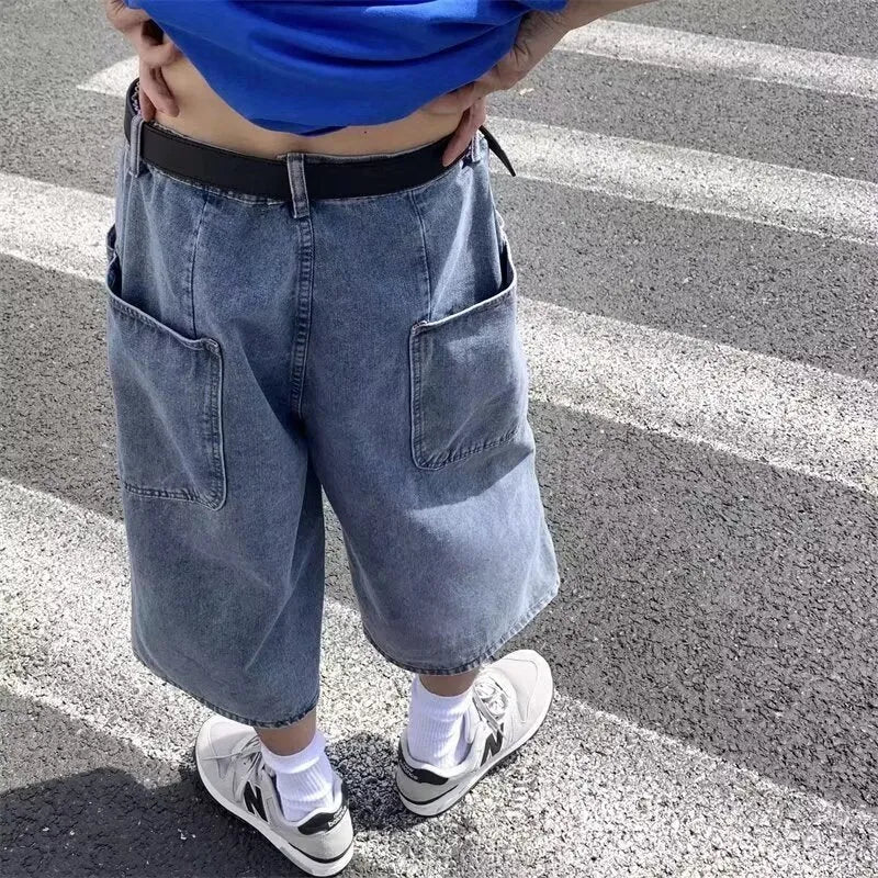 Blue men's washed denim pirate shorts with a high waist and cropped length on a neutral background.
