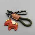 Handmade zinc alloy cowhide car key pendant on a flannel rope strap in various colour options.