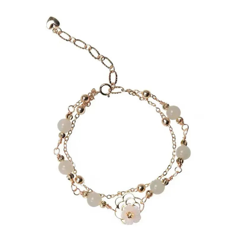 Women's copper butterfly bracelet with electroplated yellow gold finish and geometric design