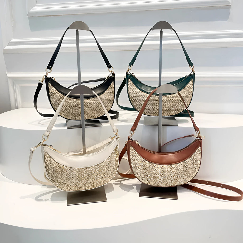 Woven straw dumpling-shaped crossbody bag with adjustable shoulder strap and internal organisational compartments
