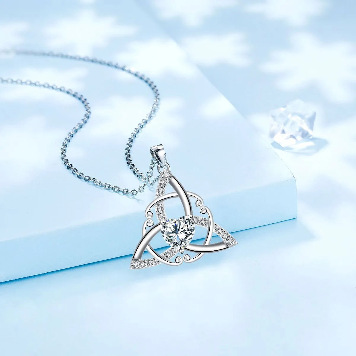 Women's copper Celtic knot necklace with geometric pendant in blue, lvzuan, red diamond, or white diamond finish.