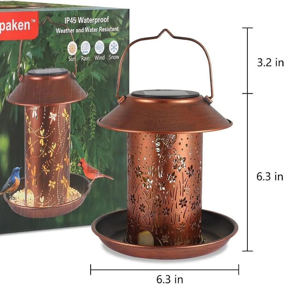 Solar garden lamp and bird feeder with hummingbird design made of iron art.