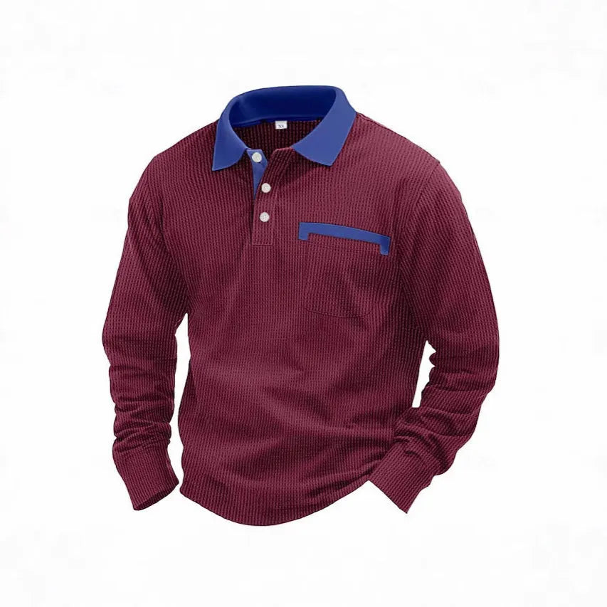 Man wearing a long-sleeved waffle-knit polo shirt in an asymmetric design, shown in a solid colour.