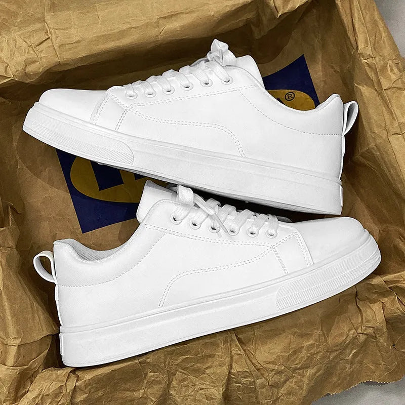 Men's low-top white and black Korean-style casual sneakers with round toe and rubber sole.