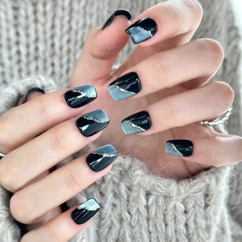 A pack of five pairs of long square-shaped false nails in assorted colours and patterns.