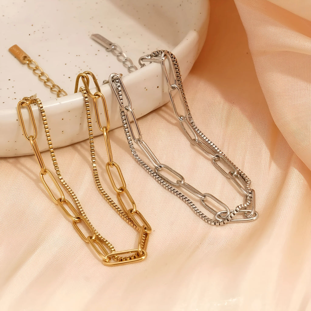Women's double layer twin titanium steel bracelet in a geometric cold style, shown in gold and silver colours.