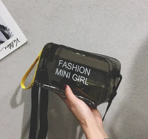 Transparent square jelly shoulder bag with adjustable strap showing internal mobile phone compartment