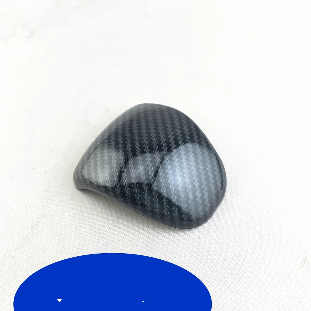 Black carbon fibre pattern gear shift head cover for Smart RunK3 car interior.