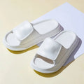 EVA flip-flop slippers with thick sole in assorted colours on a white background.