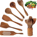 Wooden kitchen utensil set of 7 pieces including spoons and spatulas on a table