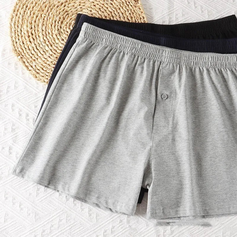 Men's solid colour cotton boxer shorts with a high waistband and loose leg.