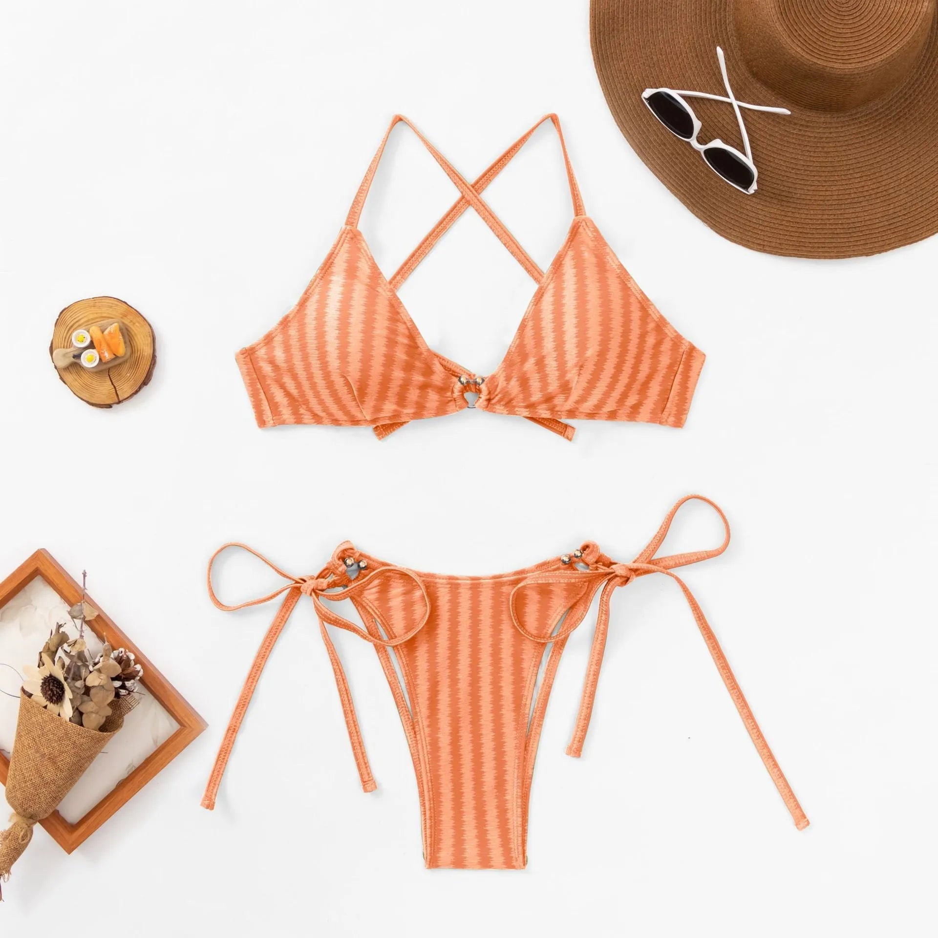Red women's two-piece bikini set with lace-up front on a jacquard top and split briefs.