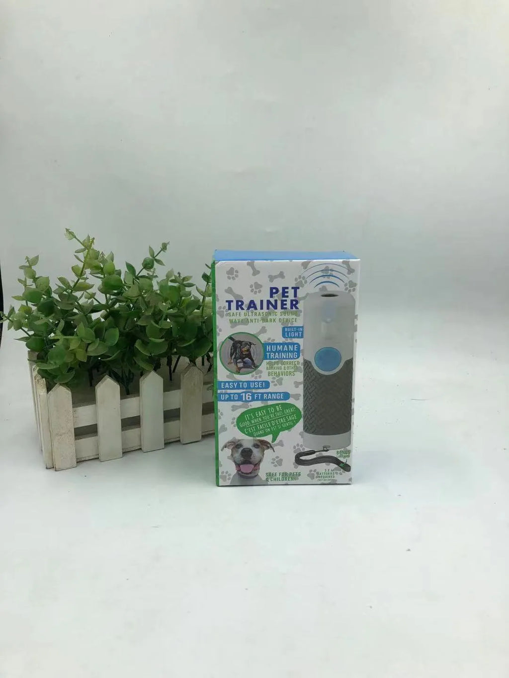 White ultrasonic dog trainer handheld device for bark control training