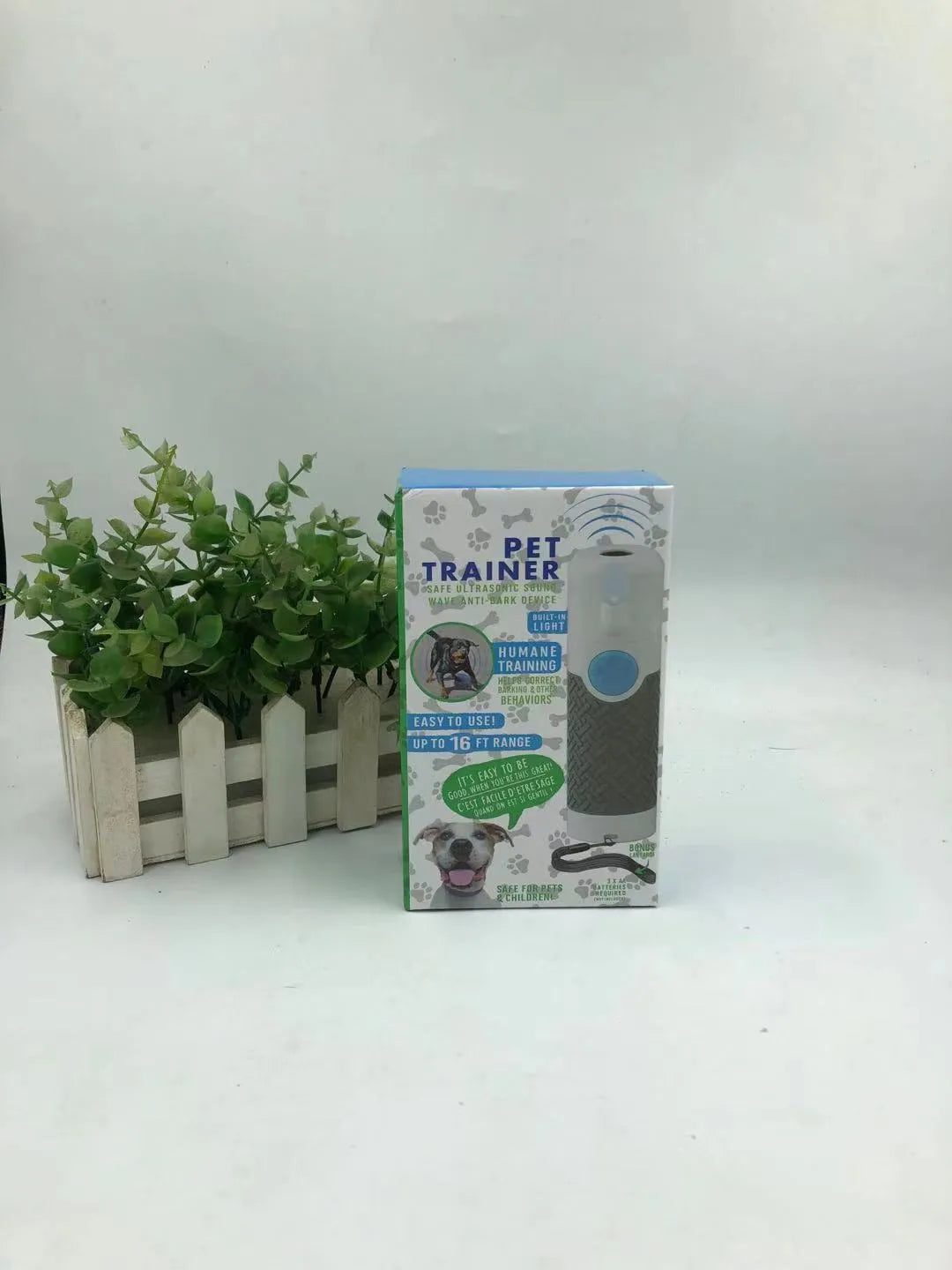 White ultrasonic dog trainer handheld device for bark control training