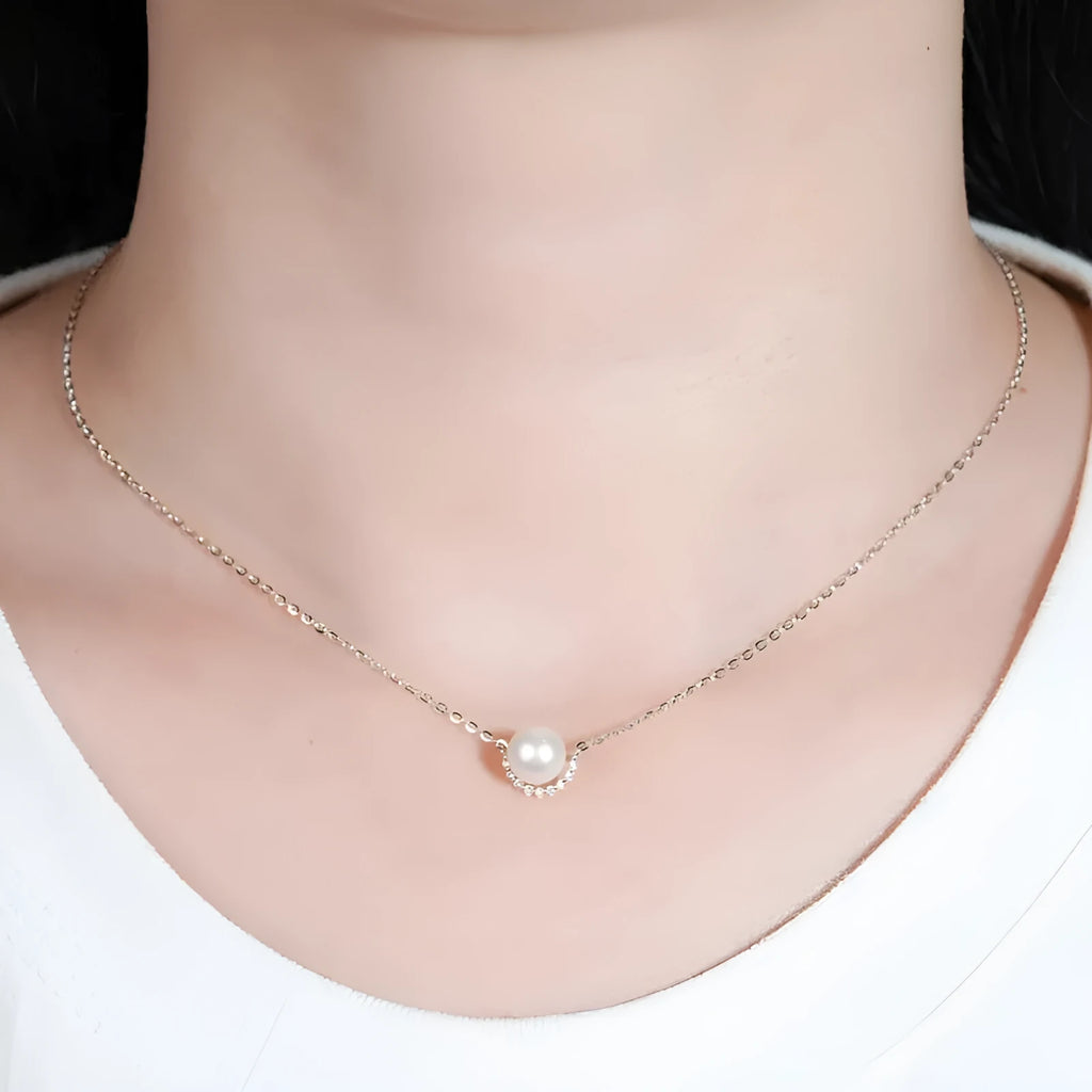 Women's 925 silver pendant necklace with pearl inlay and rhinestone accents in gold finish