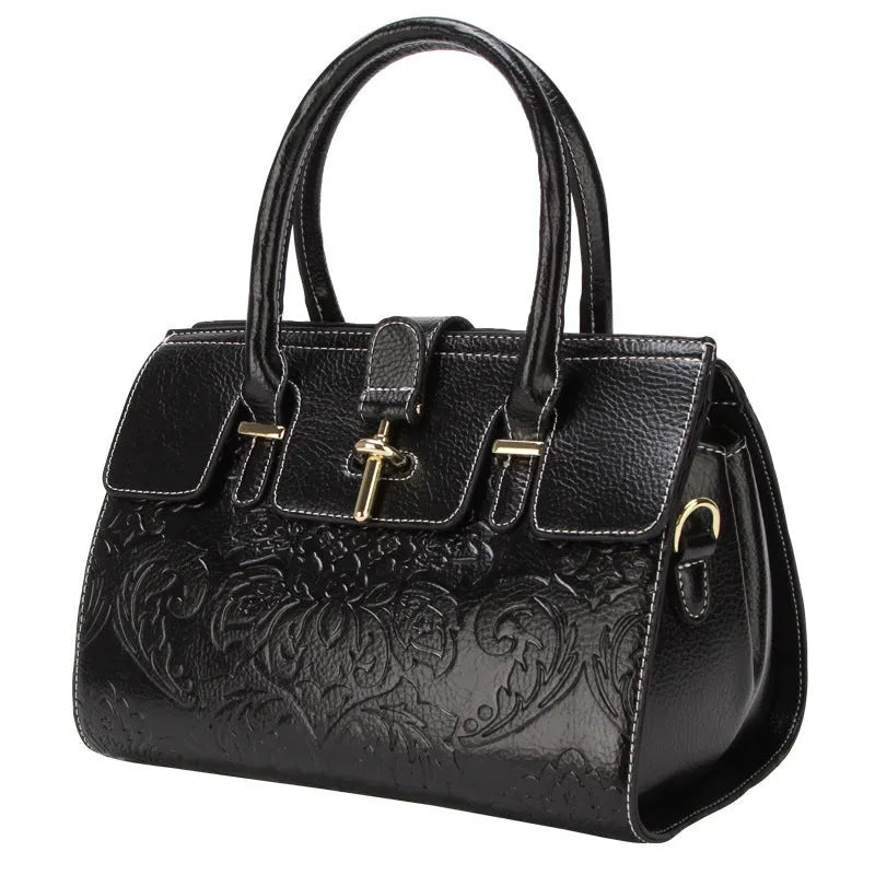 Red vintage women's crossbody leather bag with embossed pattern and multiple internal compartments