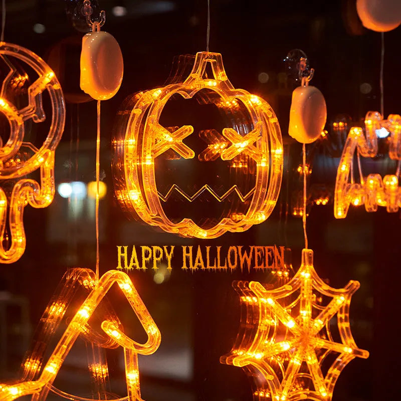 Halloween window hanging LED lights 7-piece set with spider pumpkin ghost designs on display