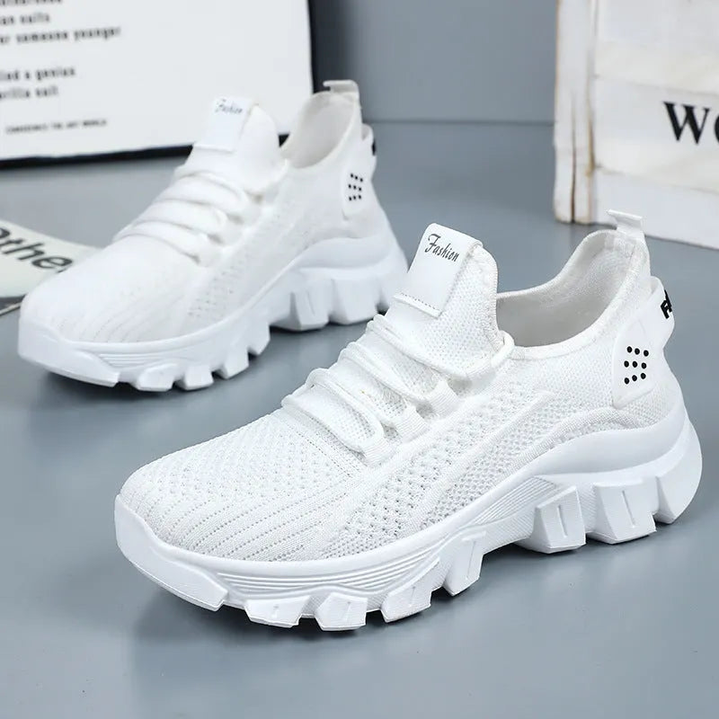 Men's white Flyknit running sneakers with thick PVC sole and lace-up closure