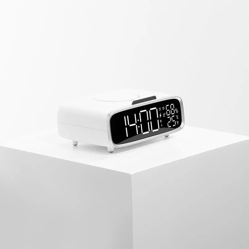 White wireless charger with Bluetooth speaker and night light on bedside table