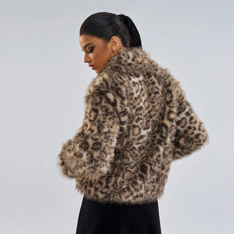 Women's leopard print polyester coat with buckle lapel detail showing regular sleeves and mid-length design