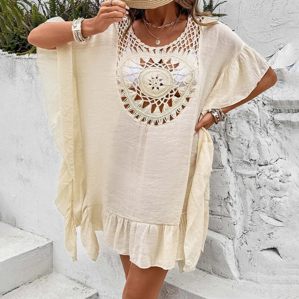 Women's apricot crochet stitch beach dress with patchwork skirt and tassel detail.