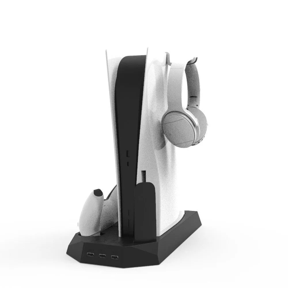 Black PS5 charging and cooling base holding a console with two controllers plugged in.