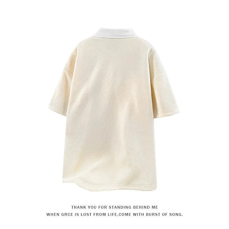 Men's heavy Henry collar polo shirt sweater in black and apricot colours showing short sleeve pullover design