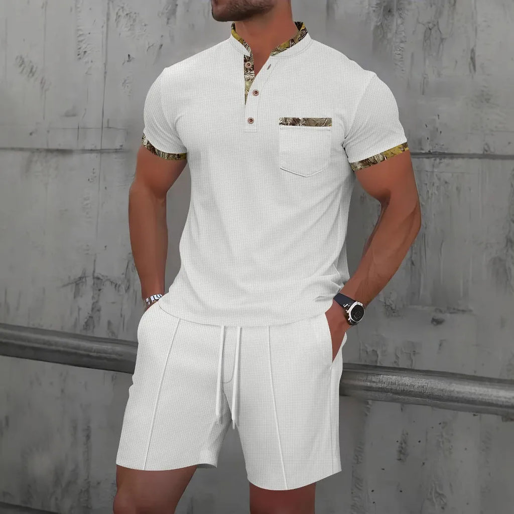 Men's grey short sleeve zip-up polo collar top and matching shorts laid flat.