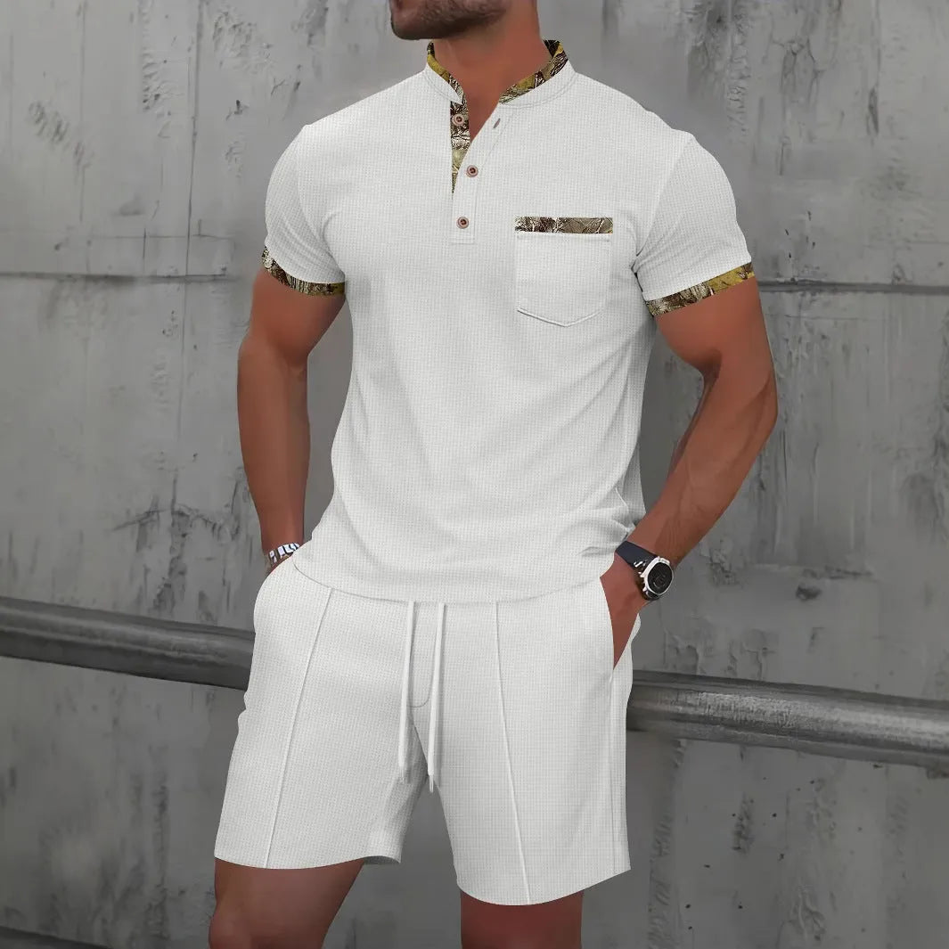 Men's grey short sleeve zip-up polo collar top and matching shorts laid flat.