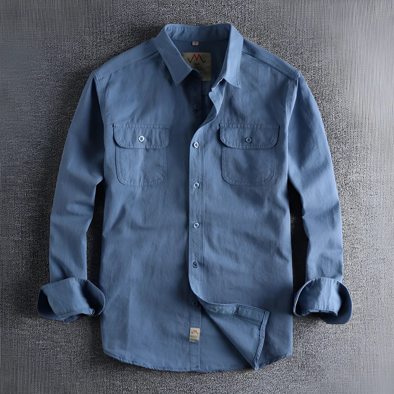 Men's solid colour long sleeve cotton shirt in cardigan style on a hanger.