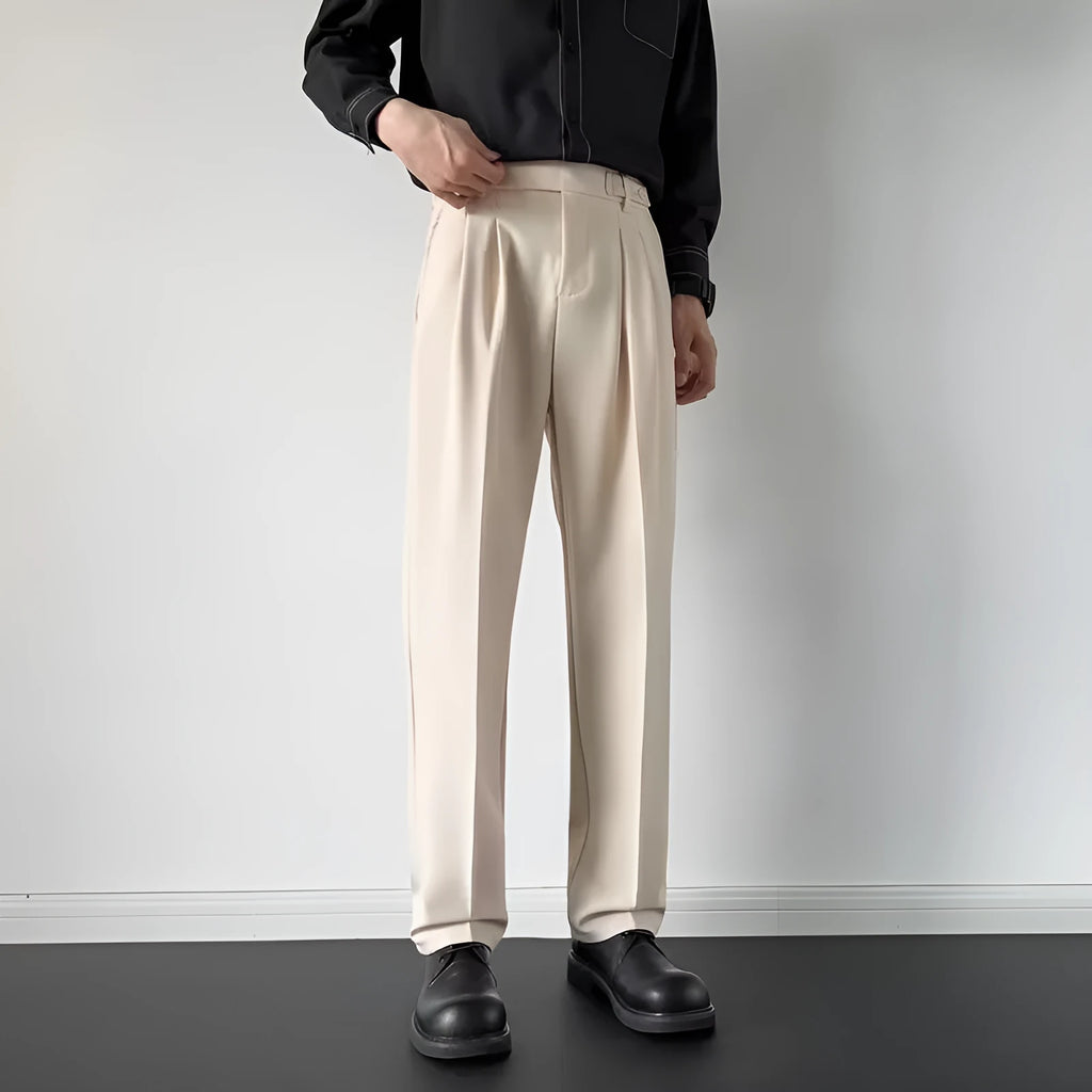 Men's straight fit suit trousers in apricot colour showing looser leg cut and polyester fabric texture