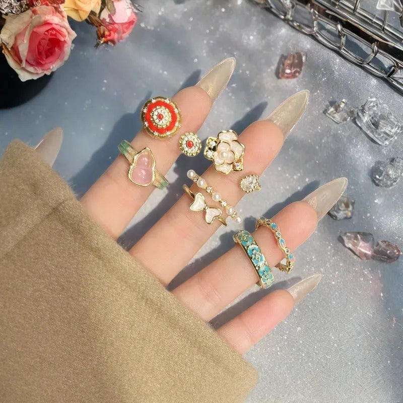 Adjustable vintage oil dripping finish copper ring with gourd motif and inlaid zircon stones.