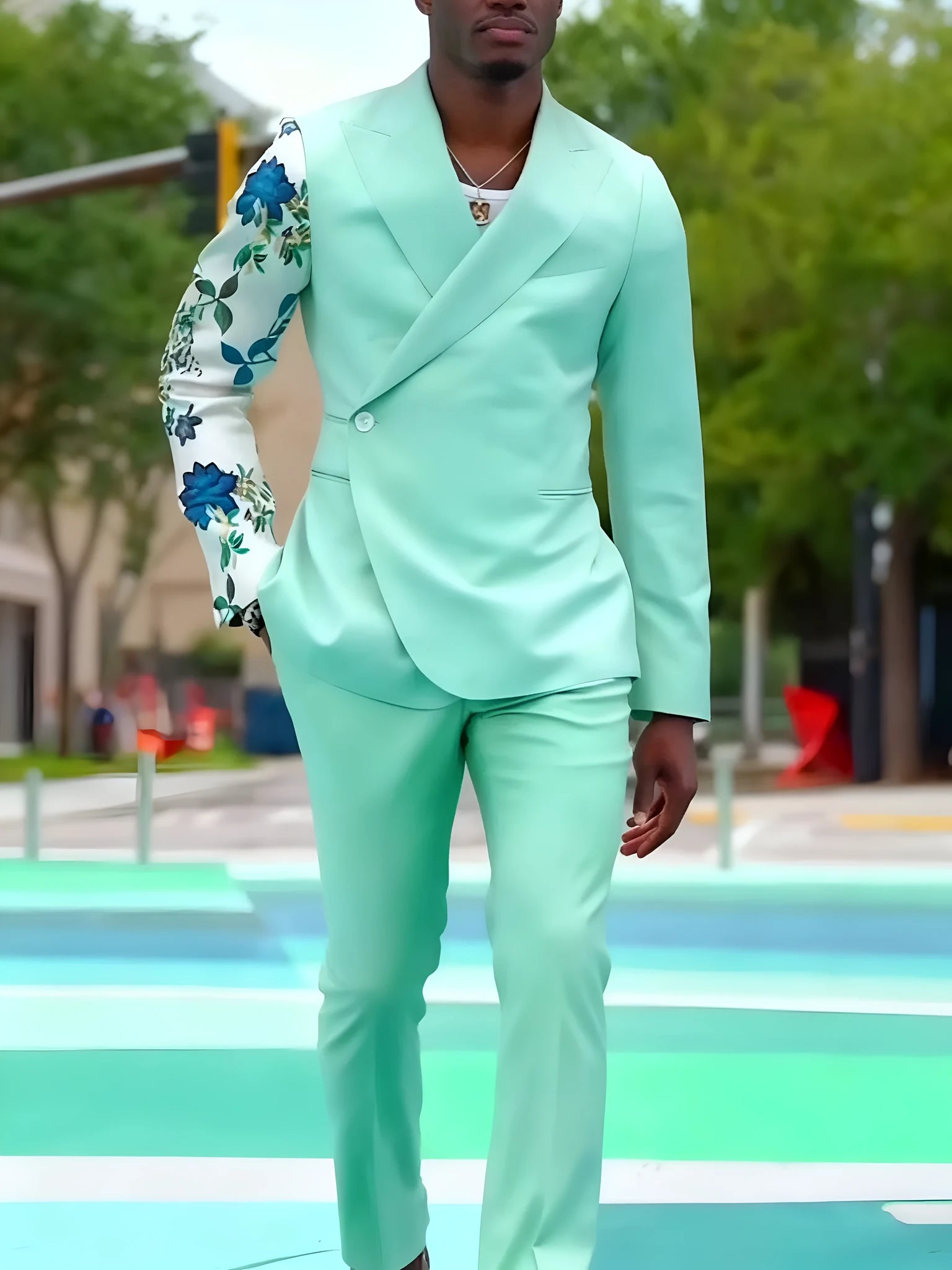 Mint green women's suit with double-breasted blazer and floral print sleeves, paired with ankle-length pants