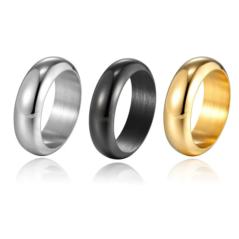 Glossy electroplated titanium steel ring in gold, black and steel colours showing detailed finish