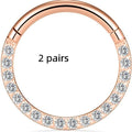 Close-up of a stainless steel seamless nose ring hoop in a gold electroplated finish.