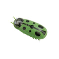 Small electric ladybird beetle cat toy with 12 walking legs on grey surface
